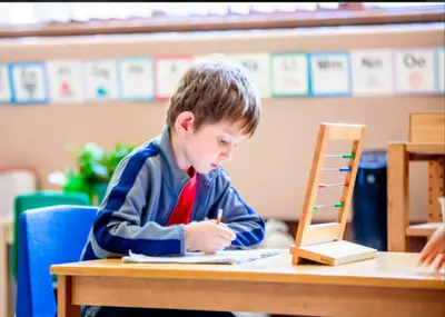 Children engaged in Montessori learning at Forest Grove Pre-School - photo 38
